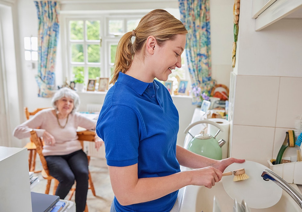 Caregiver assisting with daily living activities at home